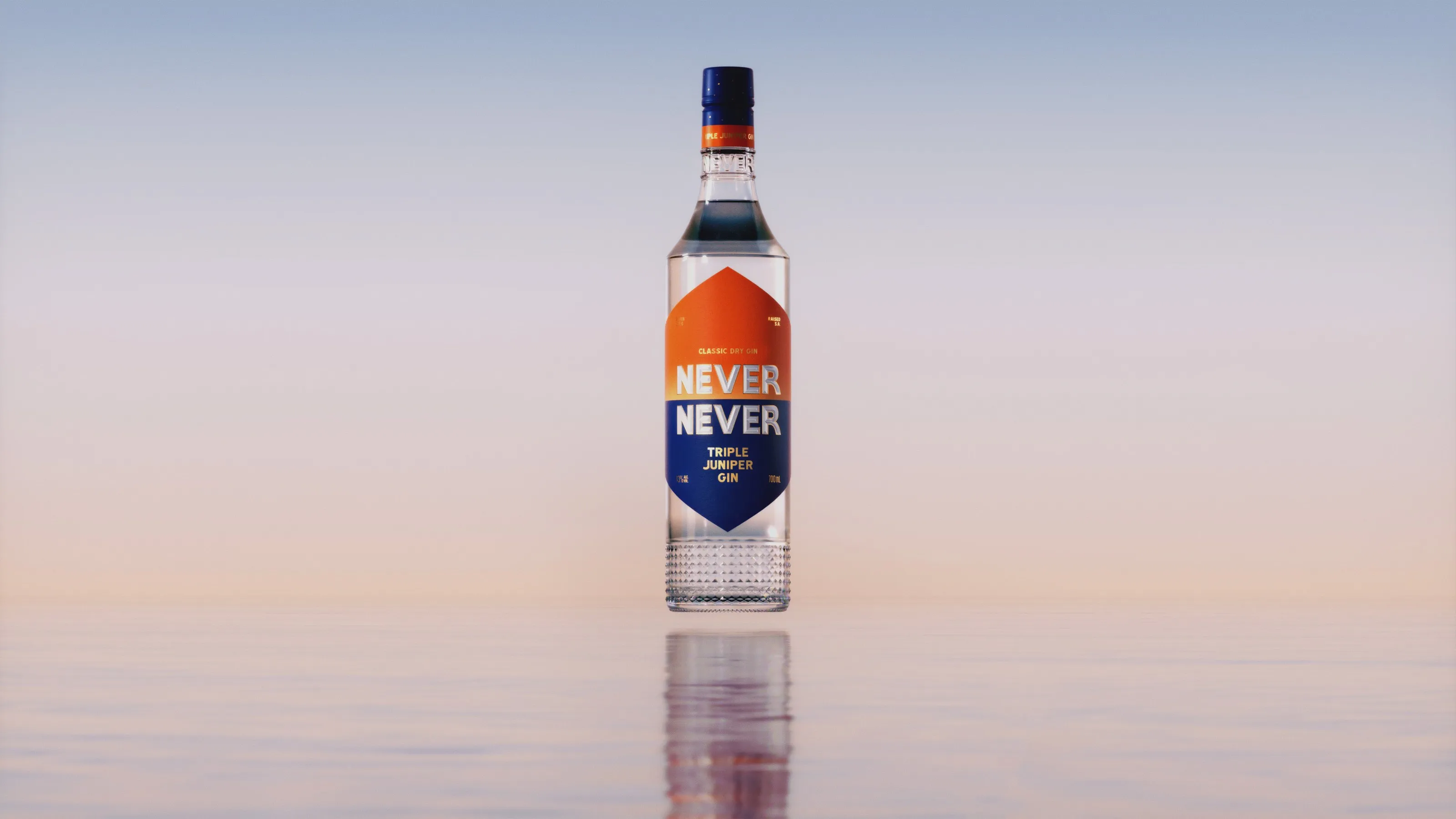 Never Never Triple Juniper Gin bottle standing on still water at first light