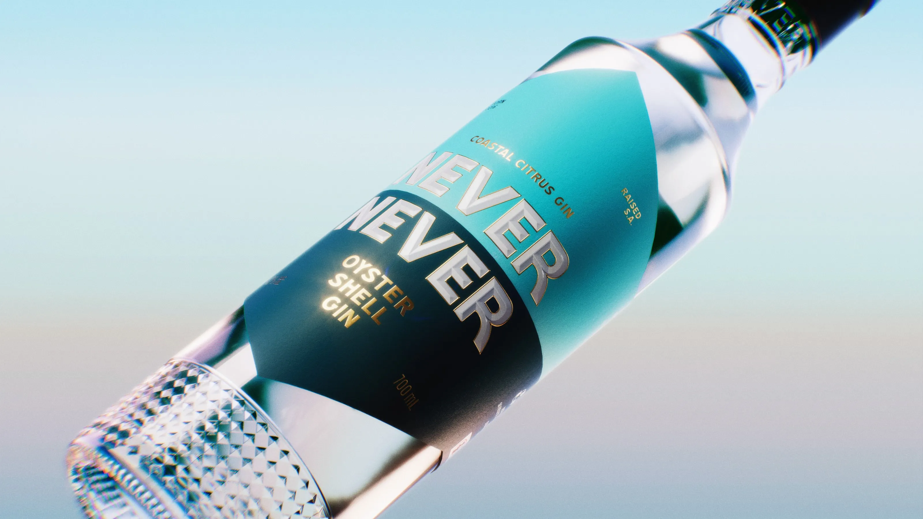 Close-up of the Never Never Oyster Shell Gin bottle against a pale blue sky