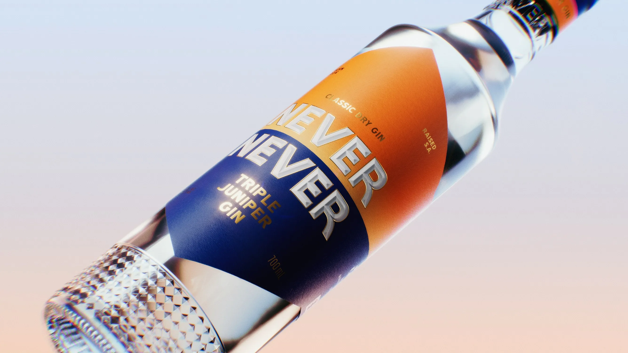 Close-up of the Never Never Triple Juniper Gin bottle and its bevelled glass base
